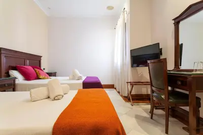 Cama o camas de una habitación en Hotel Baco