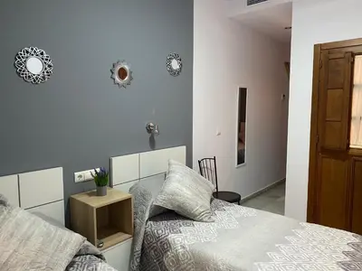 Cama o camas de una habitación en Hostal Puerta Carmona