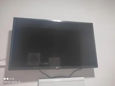 Una televisión o centro de entretenimiento en Hostal Puerta Carmona