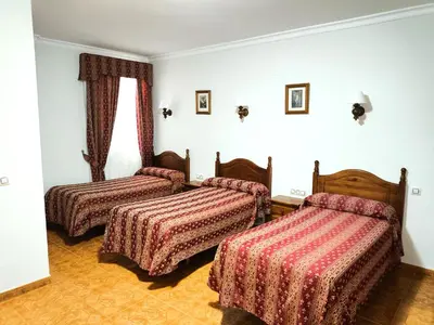 Cama o camas de una habitación en Hostal Bellido