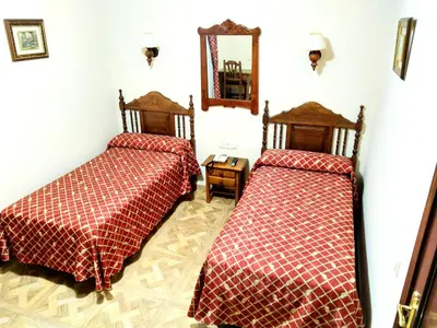 Cama o camas de una habitación en Hostal Bellido