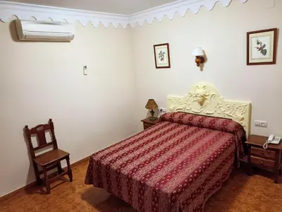 Cama o camas de una habitación en Hostal Bellido