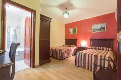 Cama o camas de una habitación en Hotel Esmeralda