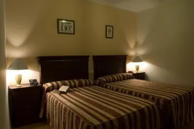 Cama o camas de una habitación en Hotel Esmeralda