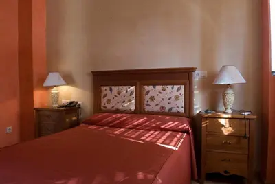 Cama o camas de una habitación en Hotel Esmeralda