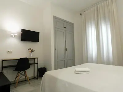 Una televisión o centro de entretenimiento en Hotel Doña Blanca