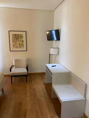 Una televisión o centro de entretenimiento en Hotel Santa Ana