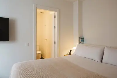 Cama o camas de una habitación en Casa Teva Rooms Sevilla