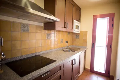 Una cocina o zona de cocina en Apartamentos Turisticos Cortijo Garces