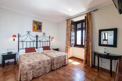Cama o camas de una habitación en Hotel Palacio del Intendente