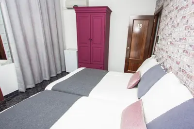 Cama o camas de una habitación en Hostal Caminito del Rey