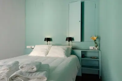 Cama o camas de una habitación en Apartamentos La Hoguera