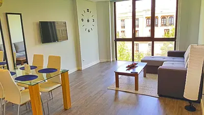 Una televisión o centro de entretenimiento en Apartamento Boulevard Gran Capitan