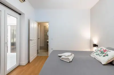 Cama o camas de una habitación en HOUSE SEVILLANA 6 habitaciones