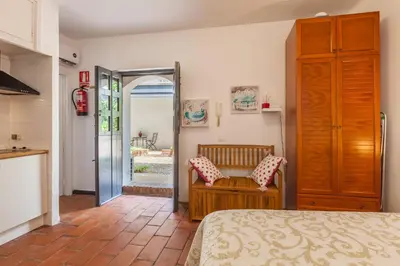 Cama o camas de una habitación en Apartamentos Gadi Corral Siglo XVI