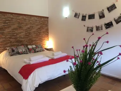 Cama o camas de una habitación en Apartamentos Gadi Corral Siglo XVI