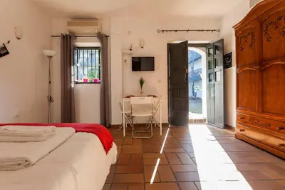 Cama o camas de una habitación en Apartamentos Gadi Corral Siglo XVI