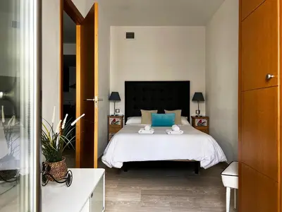 Cama o camas de una habitación en Suite Apartment City Center - Aloha Sevilla