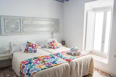 Cama o camas de una habitación en La Casa de la Costurera