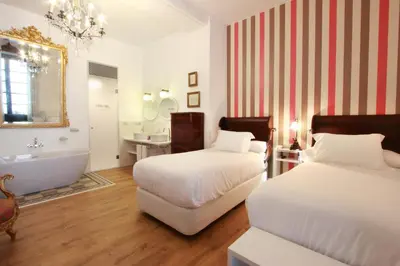 Cama o camas de una habitación en Hotel Patria Chica
