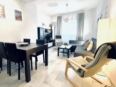 Una televisión o centro de entretenimiento en Apartamento Pintor Palomino