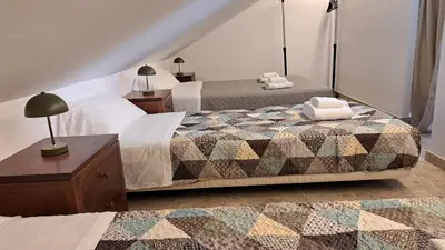 Cama o camas de una habitación en Apartamentos Maria Cristina con parking privado gratis