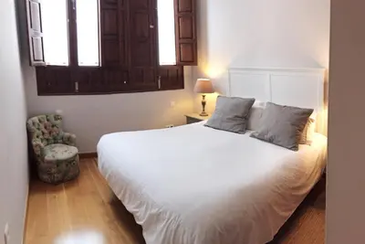 Cama o camas de una habitación en 19th Century Sevillian Apartment