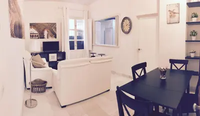 Una televisión o centro de entretenimiento en Apartamento Barrio Santa Cruz
