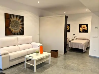 Cama o camas de una habitación en Apartamentos Turísticos Córdoba Califal