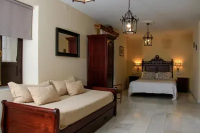 Cama o camas de una habitación en Apartamentos Medina Qurtuba