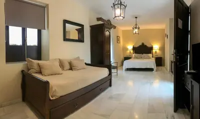 Cama o camas de una habitación en Apartamentos Medina Qurtuba