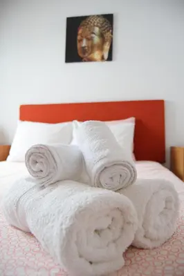 Cama o camas de una habitación en Enjoy Sevilla