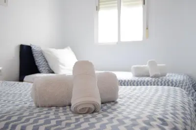 Cama o camas de una habitación en Enjoy Sevilla