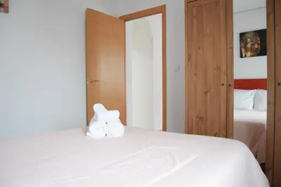 Cama o camas de una habitación en Enjoy Sevilla
