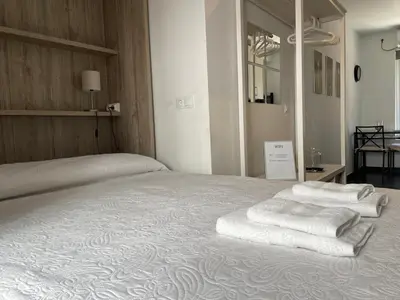 Cama o camas de una habitación en Loft Ciudad Jardín