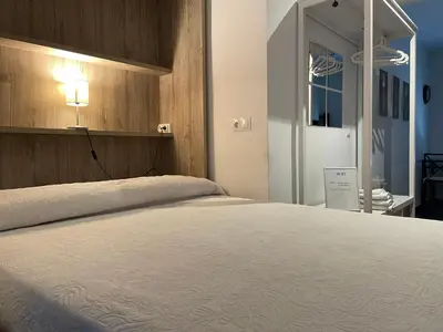 Cama o camas de una habitación en Loft Ciudad Jardín