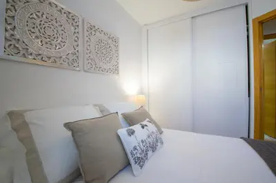 Cama o camas de una habitación en SunShine Plaza Abades