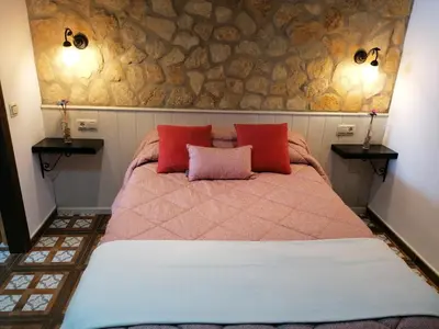 Cama o camas de una habitación en La Casa de Abajo
