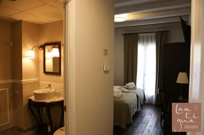 Cama o camas de una habitación en LANTIGUA CASA RURAL