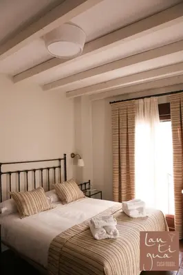 Cama o camas de una habitación en LANTIGUA CASA RURAL