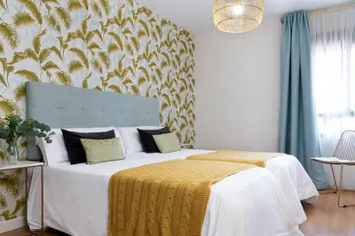Cama o camas de una habitación en Misterhost Deluxe Santa Cruz I - cozy central and quiet