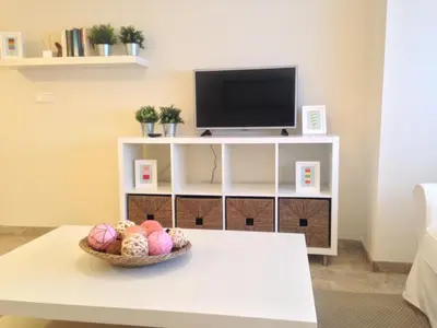 Una televisión o centro de entretenimiento en Apartamento Ollerías, 31