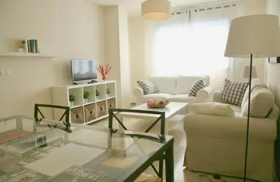 Una televisión o centro de entretenimiento en Apartamento Ollerías, 31