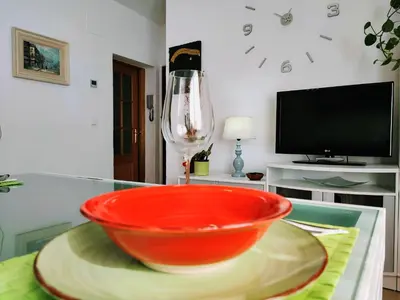 Una televisión o centro de entretenimiento en Apartamento La flor de Mayo