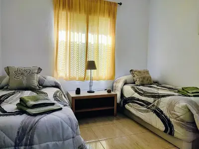 Cama o camas de una habitación en Apartamento La flor de Mayo