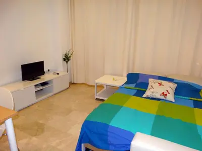 Una televisión o centro de entretenimiento en Minimalist Loft Center by gms apartamentos