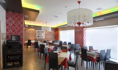 Una televisión o centro de entretenimiento en Hotel Macami