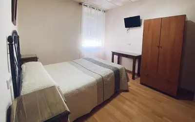 Cama o camas de una habitación en Hostal Restaurante El Paso