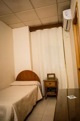 Cama o camas de una habitación en Hostal Restaurante El Paso