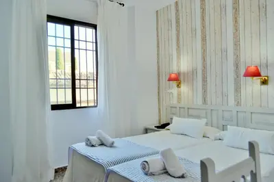 Cama o camas de una habitación en Hotel Marisa
